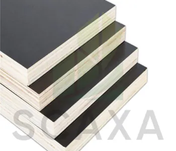 Film face shuttering plywood stacked in varying sizes, showcasing Scaxa's scaffolding material options for construction projects.