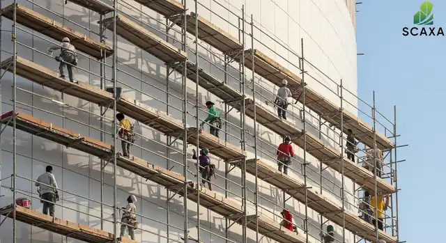 Painters working on scaffolding along a curved building facade